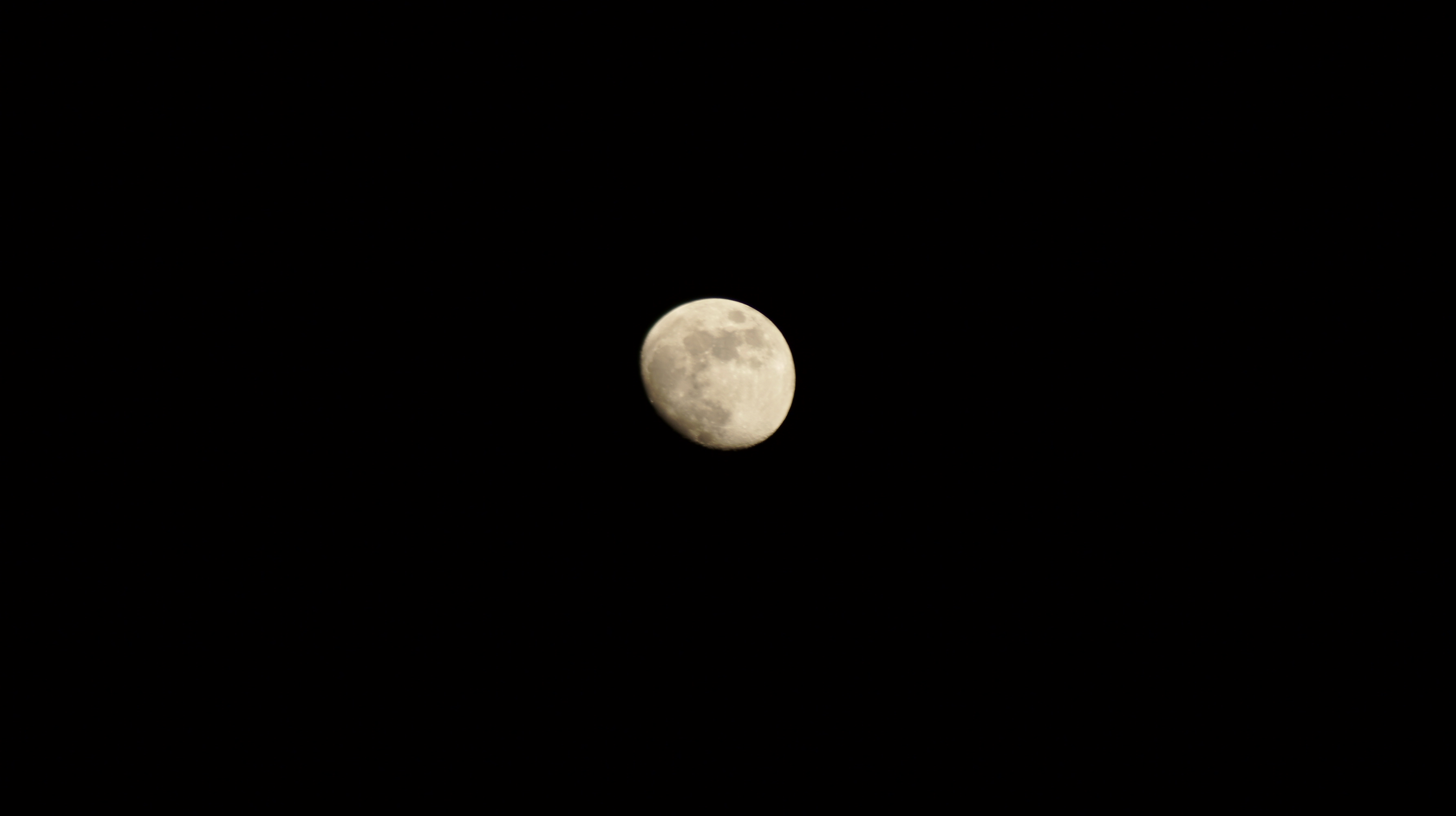 a crescent moon in a deep night sky